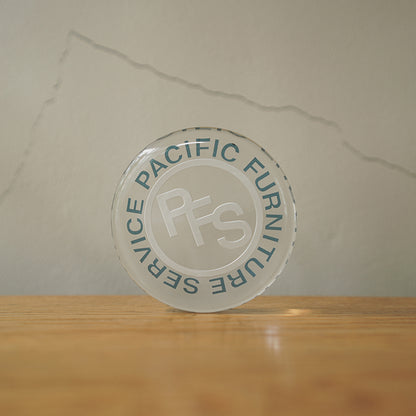 P.F.S. GLASS PAPER WEIGHT